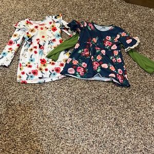 3 shirts.  The green one goes under the navy top.